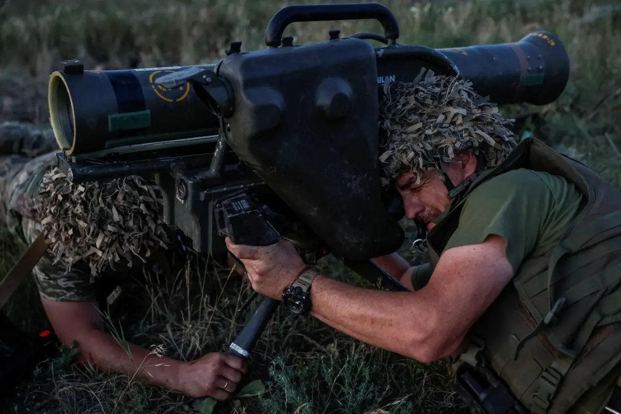 Ukrainian service members attend military drills near a frontline in Donetsk region