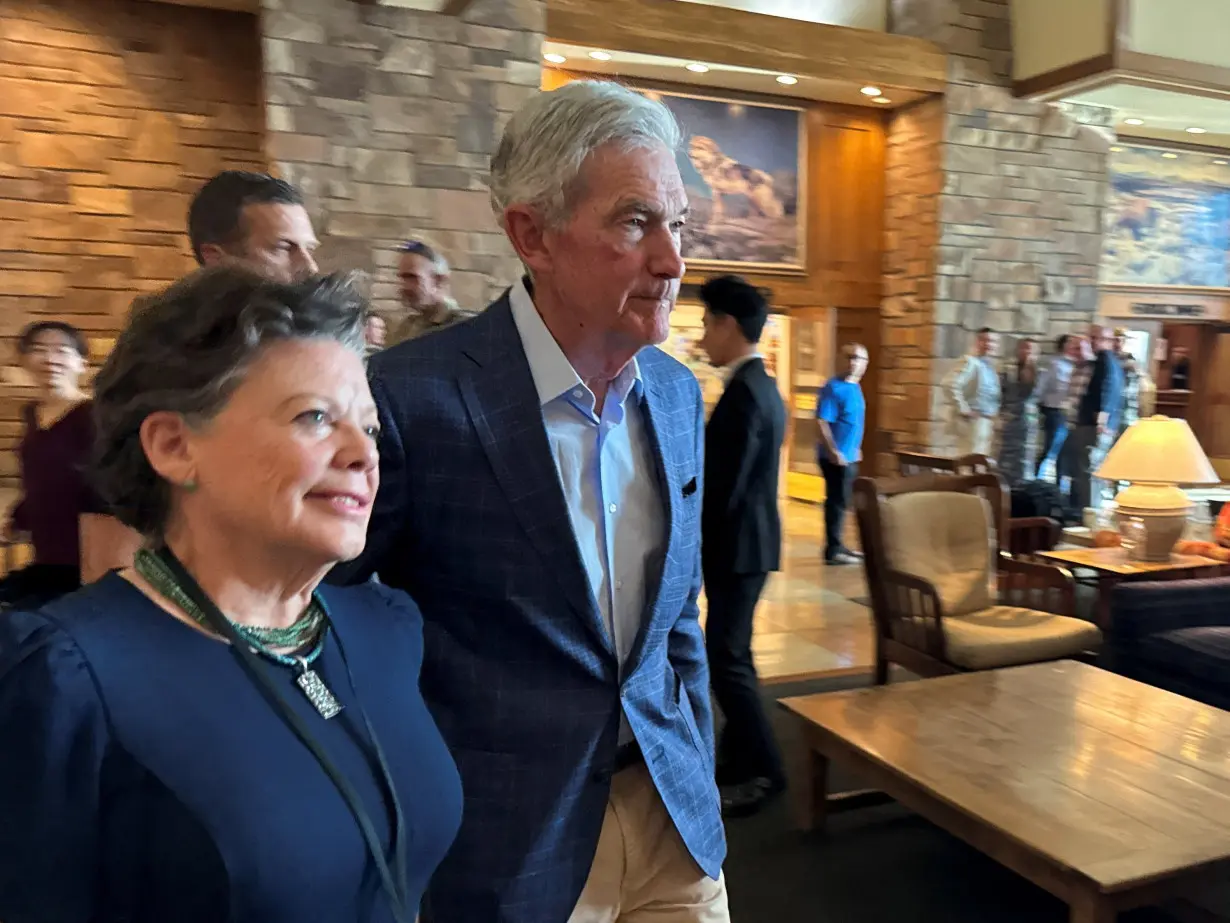 Federal Reserve Chair Jerome Powell heads into the opening dinner at the Kansas City Fed's annual economic symposium in Jackson Hole