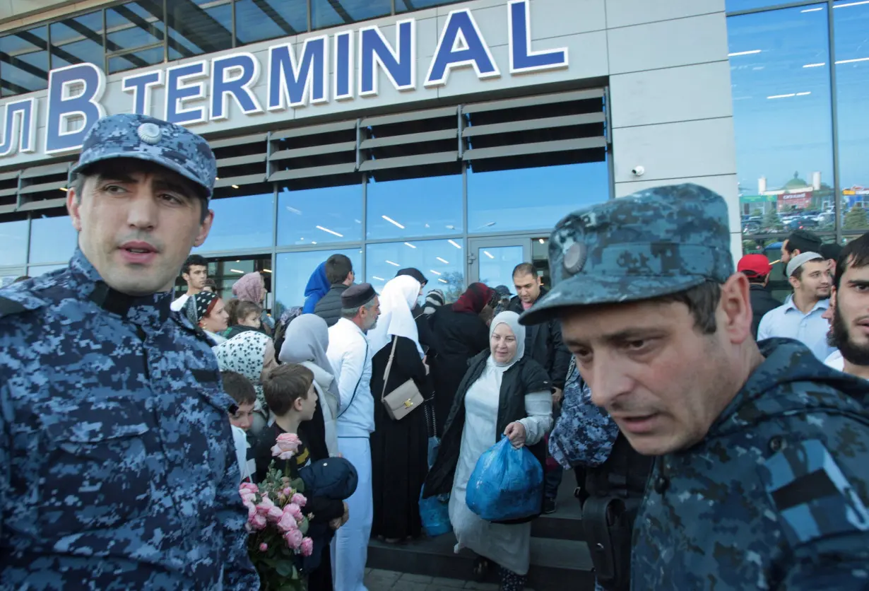 Law enforcement officers ensure security at the airport in Makhachkala