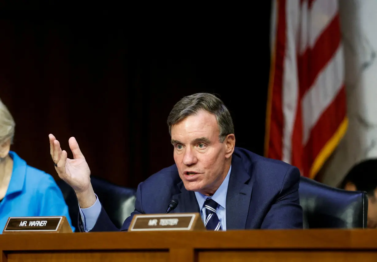 FILE PHOTO: US Senator Mark Warner is shown at a hearing in Washington