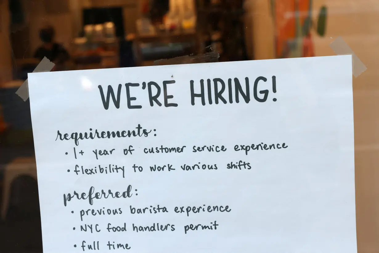 A hiring sign is seen in a cafe as the U.S. Labor Department released its July employment report, in Manhattan, New York City