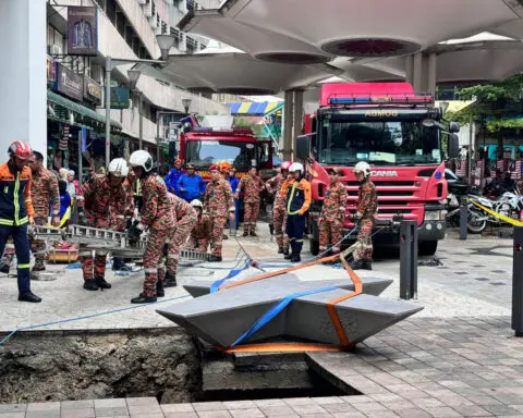Woman from India disappears down a sinkhole in Malaysia's capital