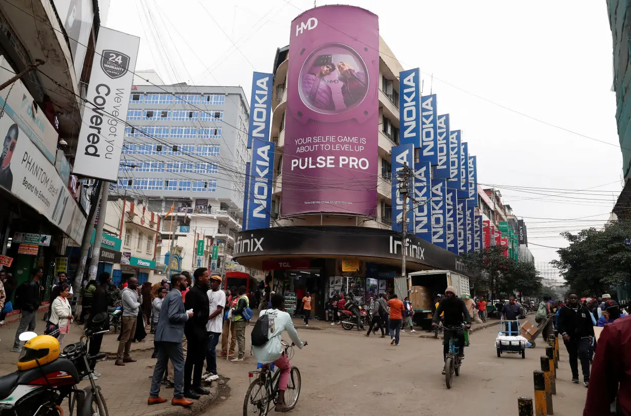 Pedestrians walk along the Luthuli Avenue in downtown Nairobi