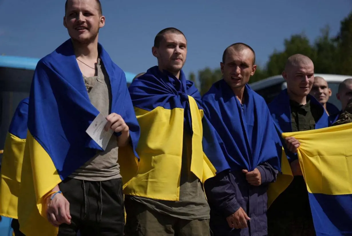 Ukrainian POWs react after a swap at an unknown location in Ukraine