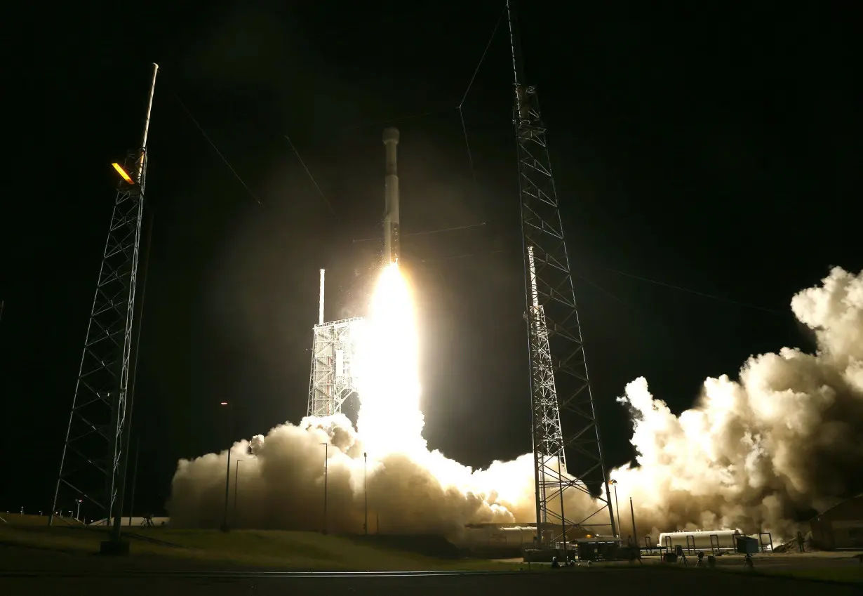 In this file 2019 photo, The United Launch Alliance Atlas V rocket, topped by a Boeing CST-100 Starliner spacecraft, lifts off on an uncrewed test flight in Cape Canaveral, Florida.