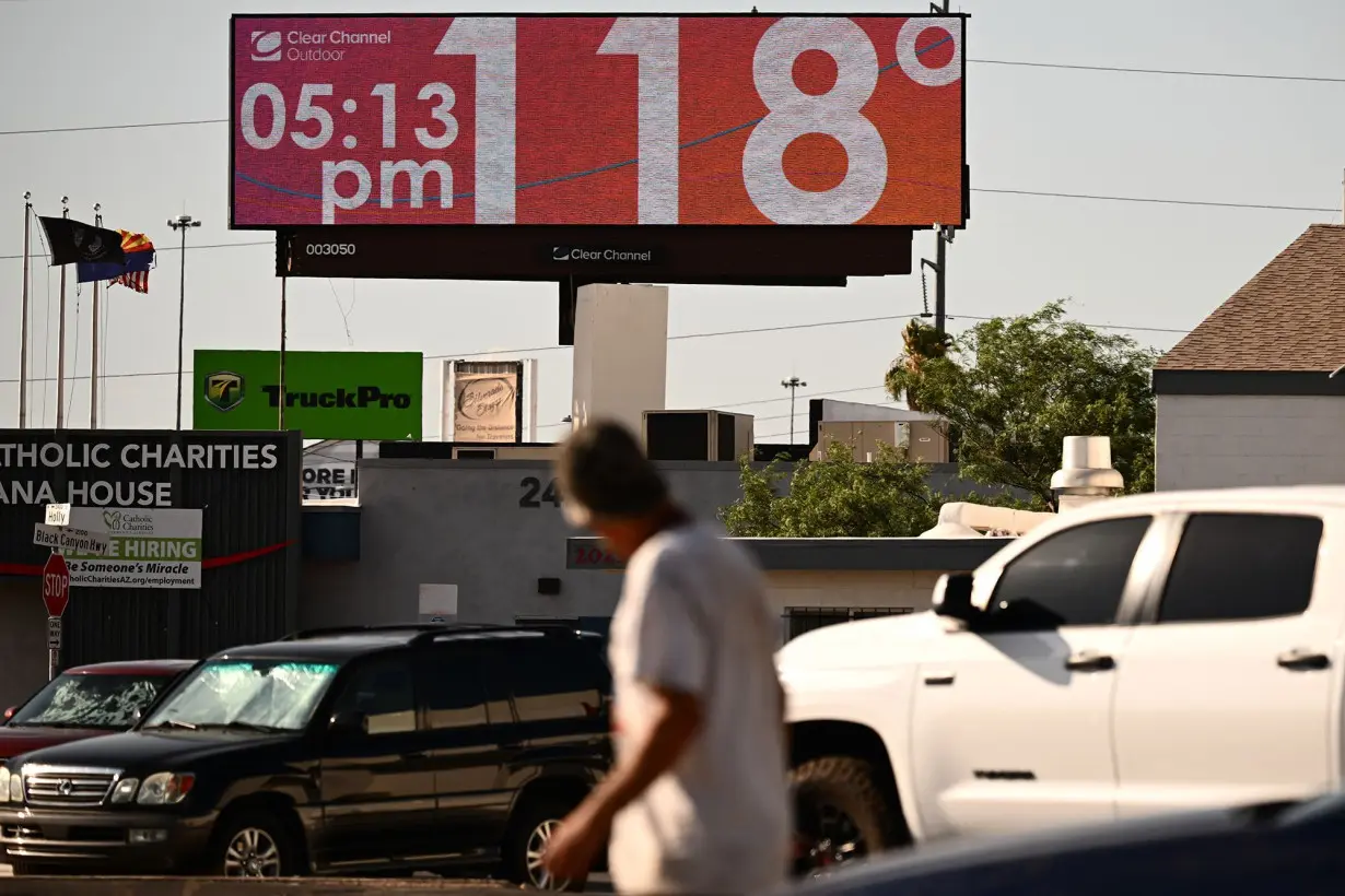 A billboard displays a temperature of 118 degrees Fahrenheit during a record heat wave in Phoenix, Arizona on July 18, 2023.