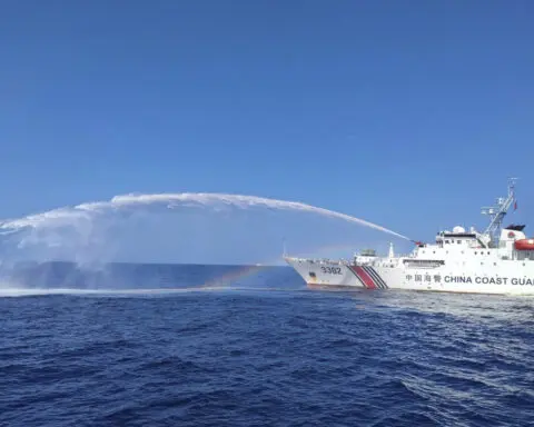 Chinese coast guard ships fire water cannons and block Philippine fisheries vessel in disputed sea