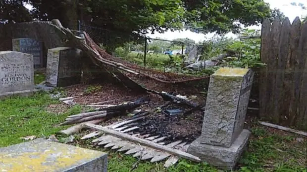 Headstone toppled, fire damage reported at cemetery