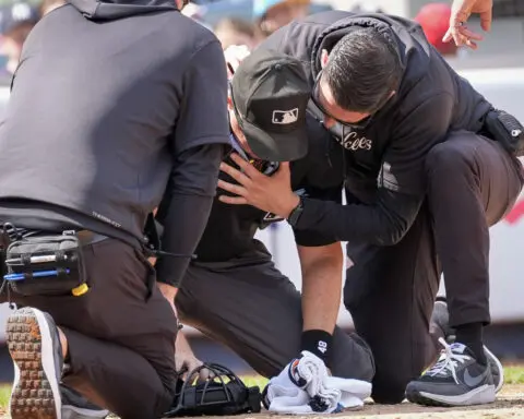 Plate umpire Nick Mahrley exits game between Rockies and Yankees after broken bat hits his neck