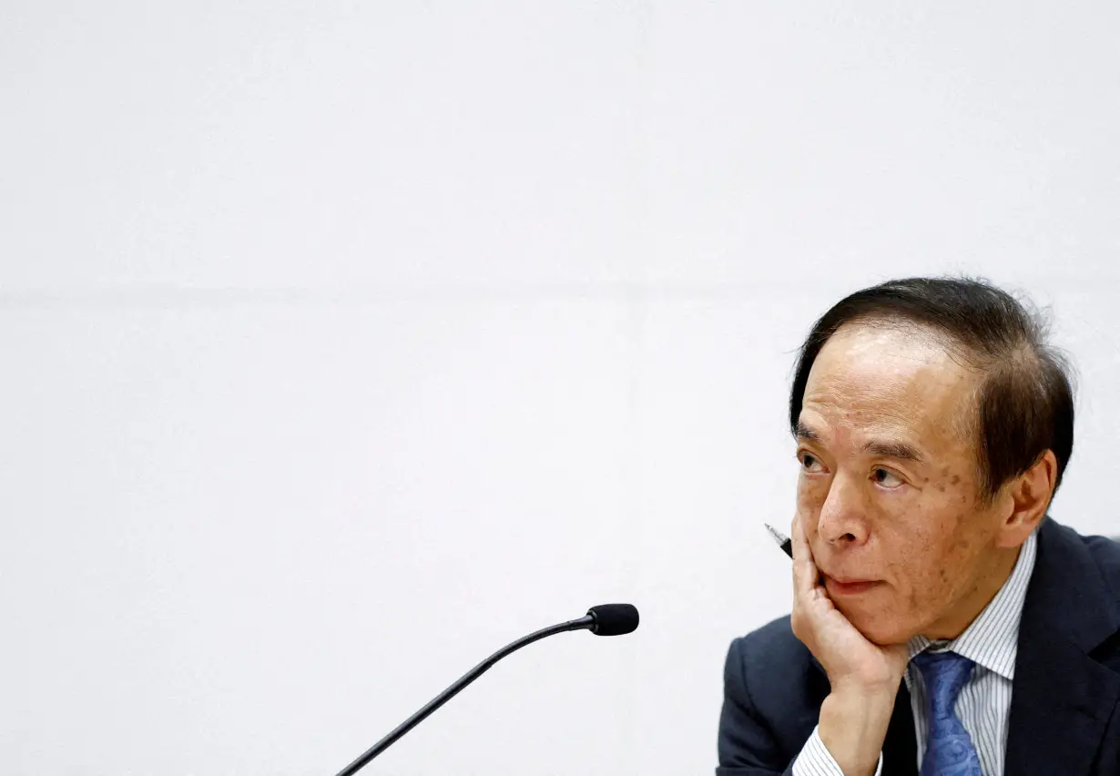 FILE PHOTO: Bank of Japan Governor Kazuo Ueda attends a press conference after its policy meeting in Tokyo