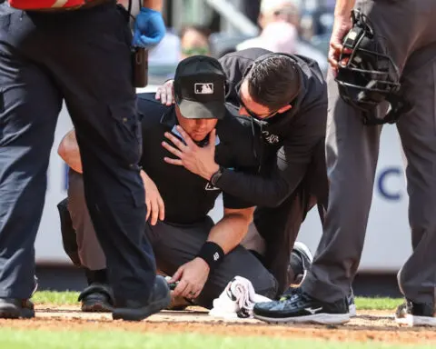 Umpire at Yankee Stadium taken off on a gurney after being struck by broken bat