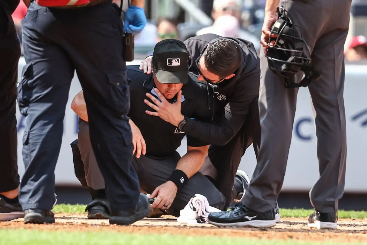 Umpire at Yankee Stadium taken off on a gurney after being struck by broken bat