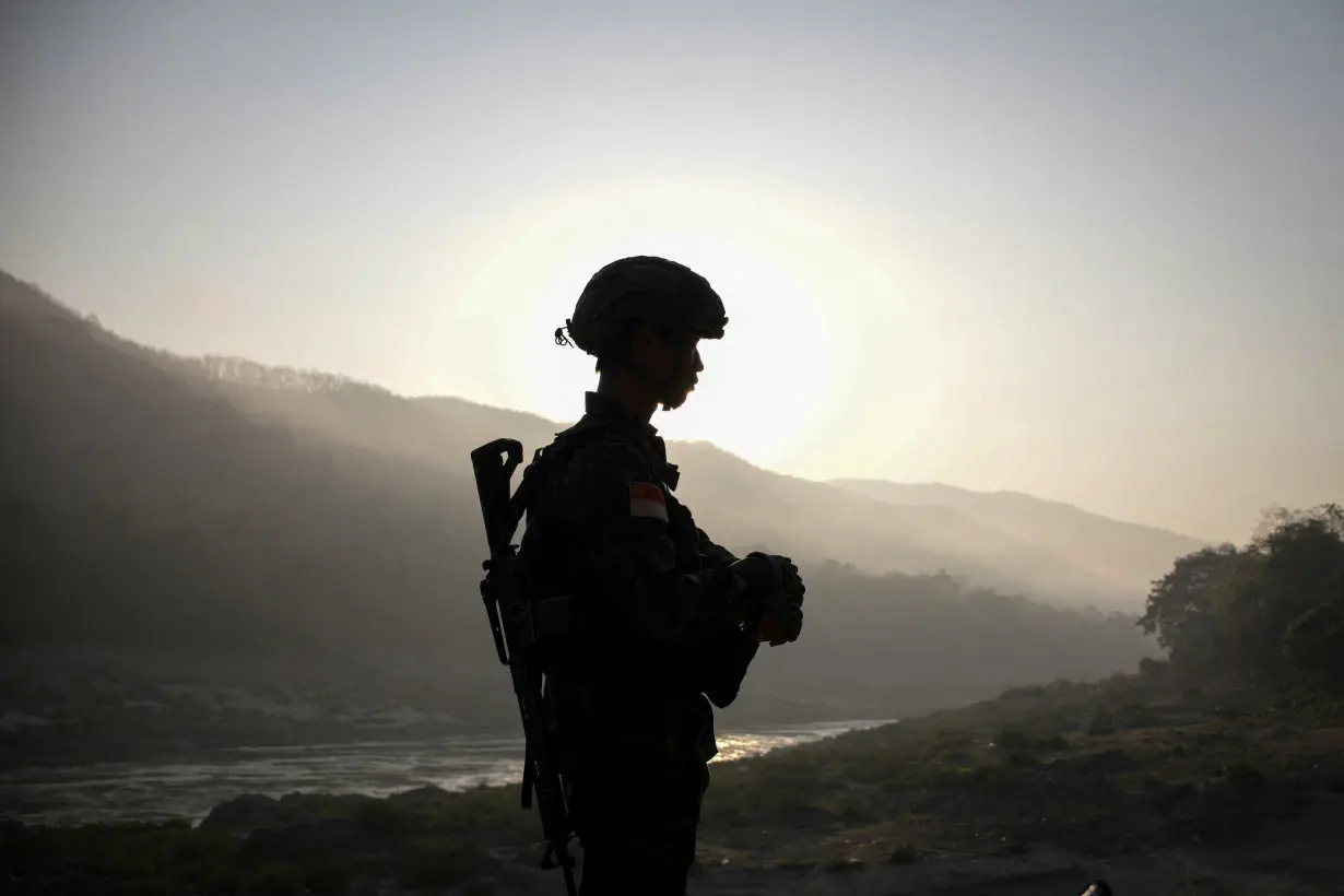 FILE PHOTO: A member of Bamar People's Liberation Army (BPLA) stands guard