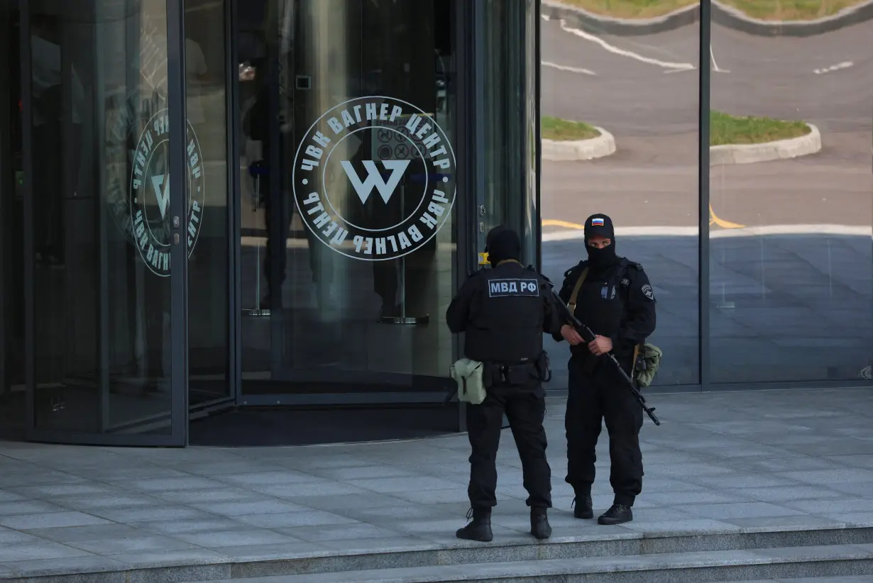 Russian law enforcement officers stand guard outside Wagner Centre in St Petersburg