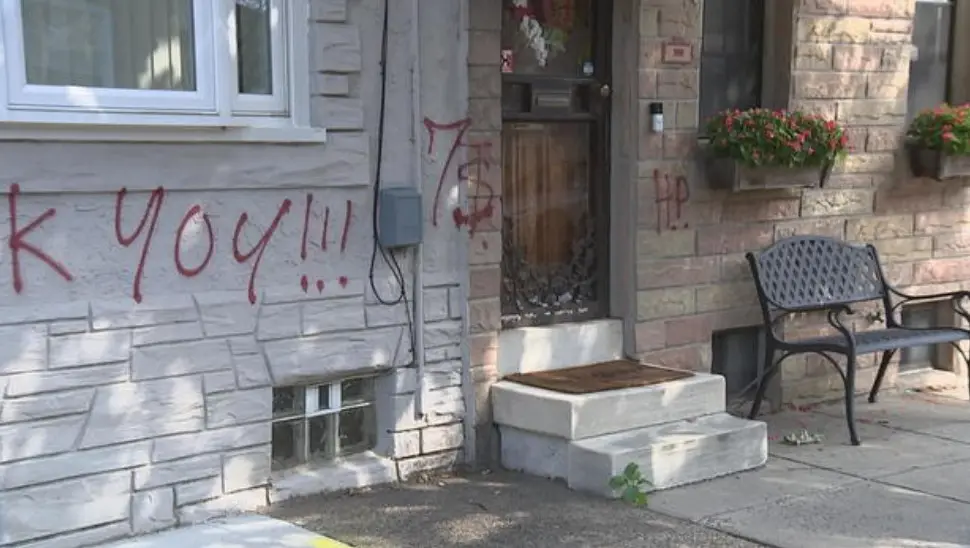 Multiple rowhomes and cars vandalized with red spray paint