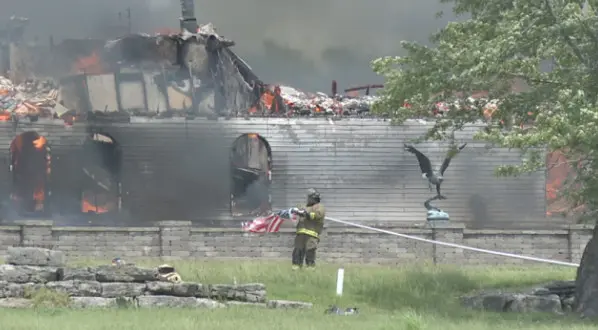 ENGULFED: House burns down, firefighter saves American flag from fire