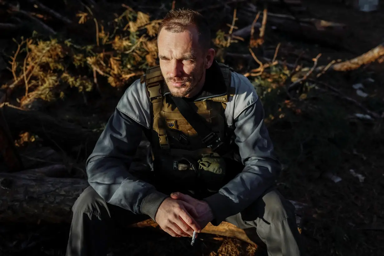 Reuters journalist Ivan Lyubysh-Kirdey rests during news coverage in Luhansk