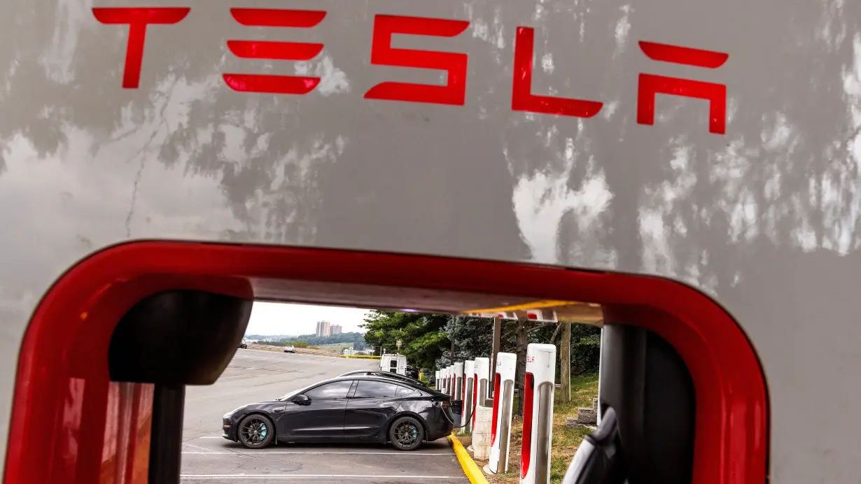 Tesla electric vehicles use a Tesla supercharging station in Union City, New Jersey