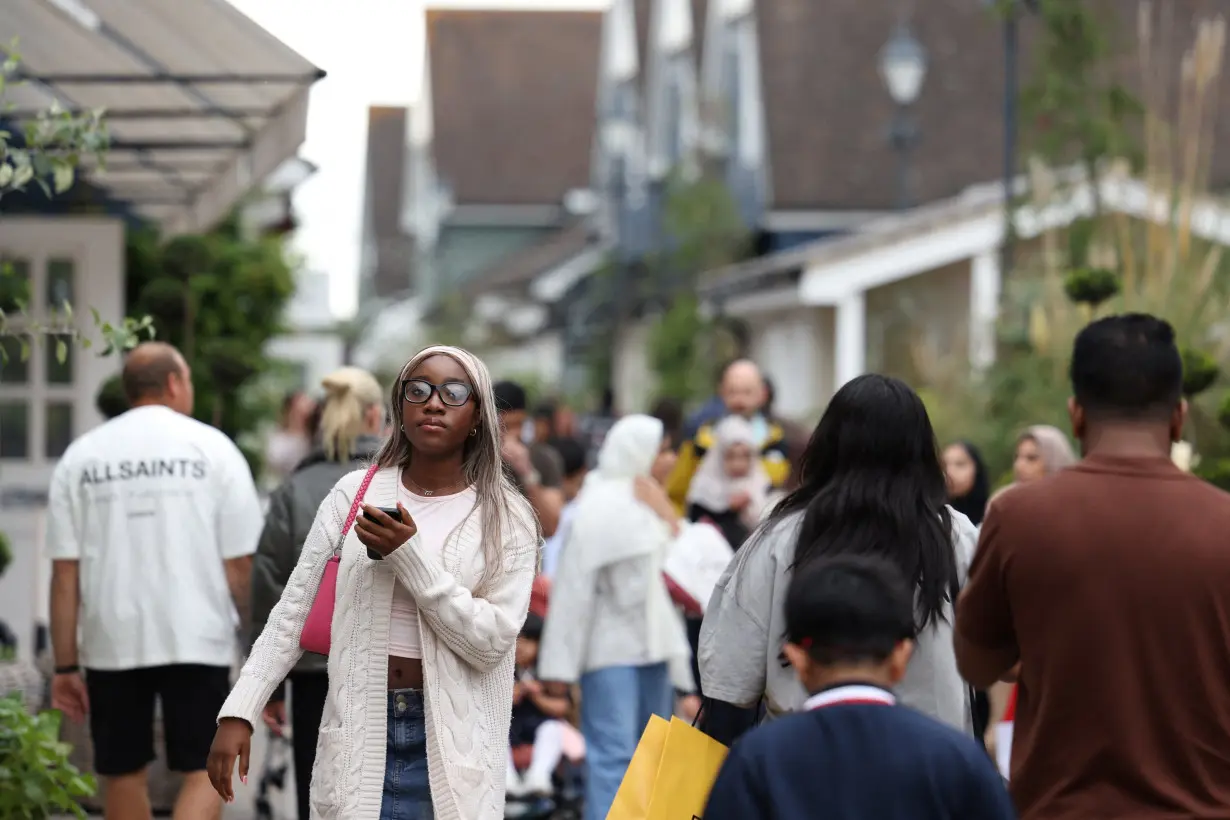 People shop at designer outlet stores at Bicester Village