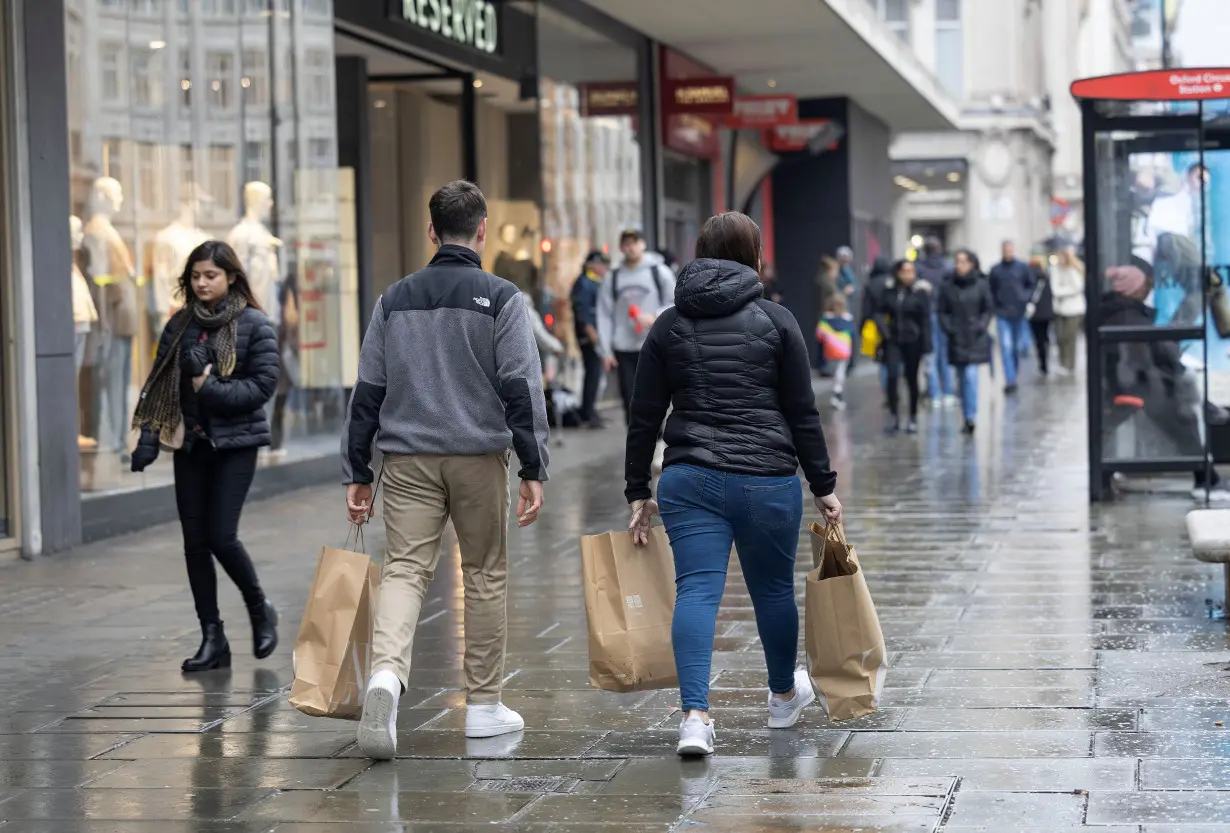 FILE PHOTO: People shop on Oxford Street in London