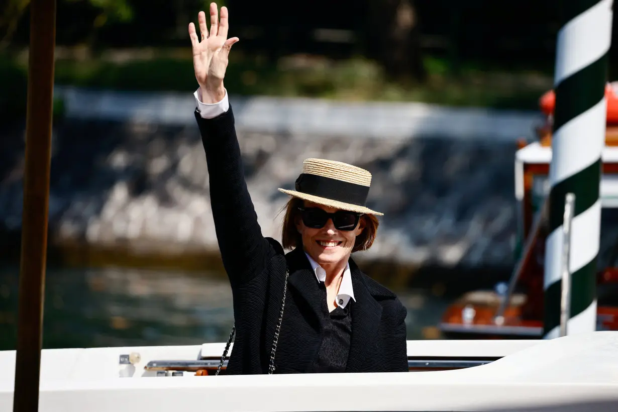 Attendees arrive for the 81st Venice International Film Festival, in Venice