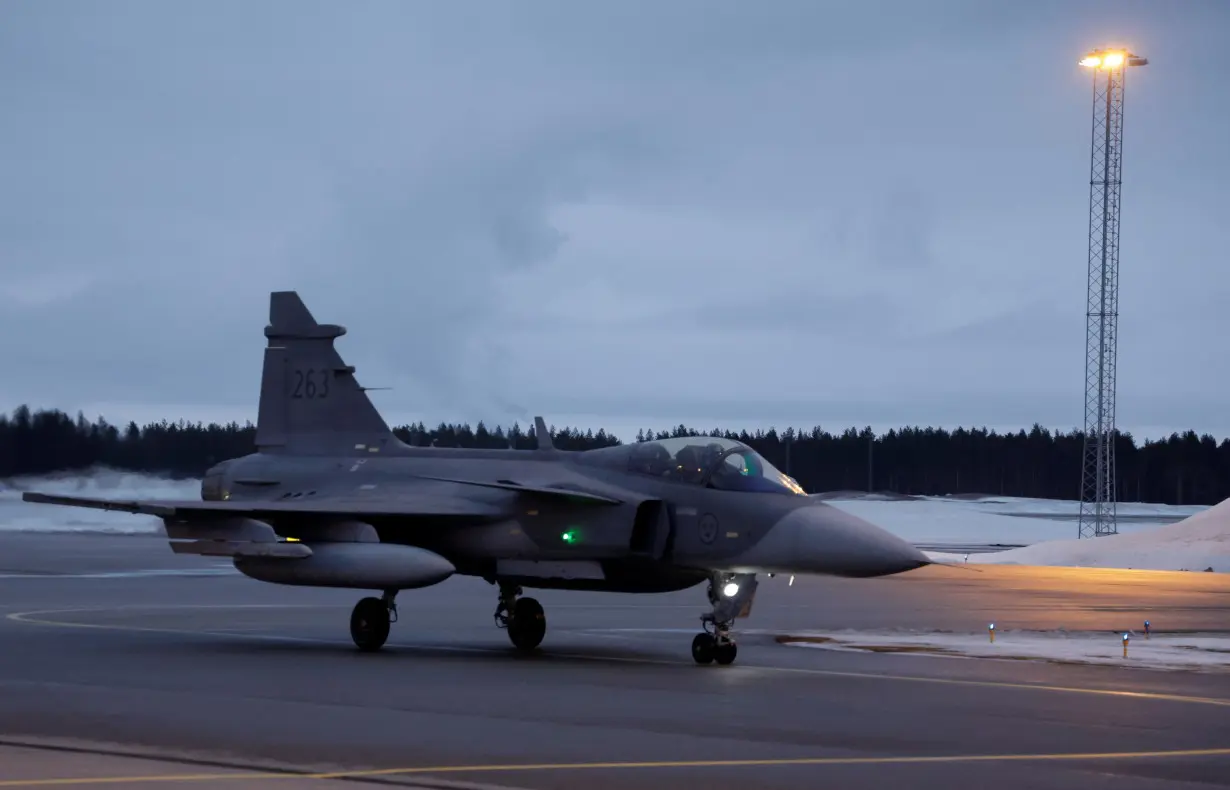 FILE PHOTO: A Swedish JAS Gripen fighter jet arrives at Kallax Air Base