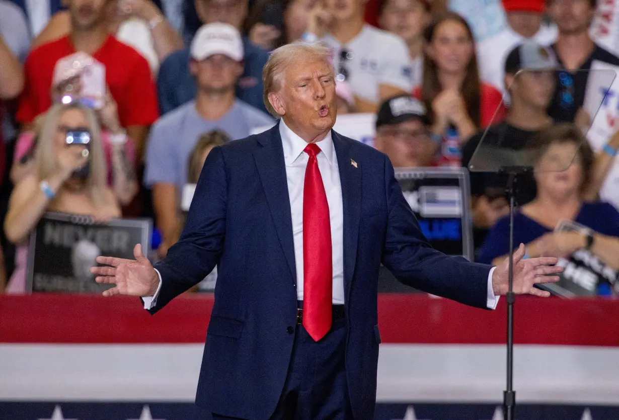 FILE PHOTO: Republican presidential nominee Trump and U.S. Senator Vance hold a rally in Minnesota