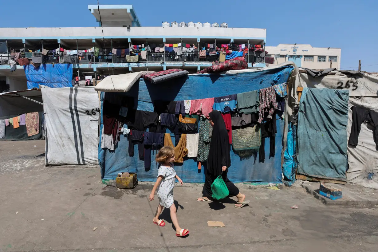 Displaced Palestinians shelter in a United Nations-run school, in Deir Al-Balah in the central Gaza Strip