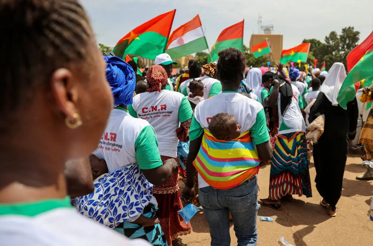 FILE PHOTO: Supporters of Burkina junta hold rally to mark one-year anniversary of coup, in Ouagadougou