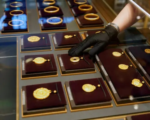 Gold falls on firmer dollar as US data takes spotlight