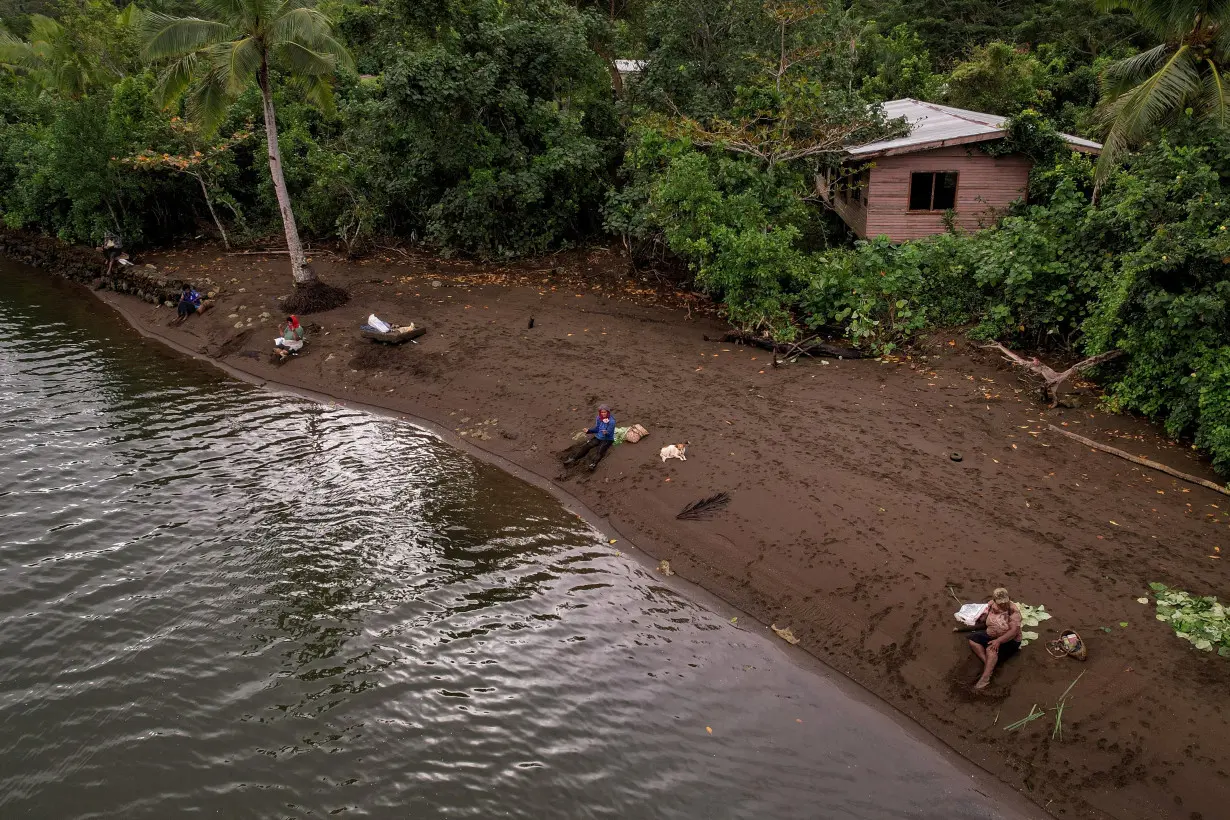 FILE PHOTO: Local residents fish in Fiji