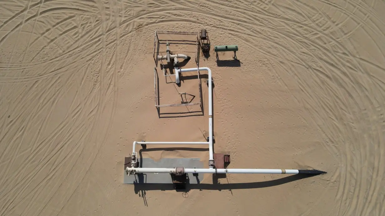 A general drone view shows the Nafoora oil field in Jakharrah