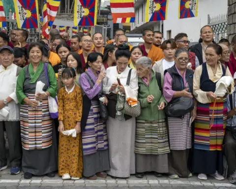 Dalai Lama returns to Indian headquarters after knee replacement surgery in the US