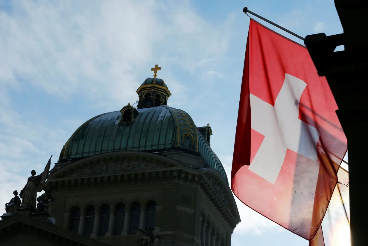 A Swiss flag is pictured in front of the Federal Palace (Bundeshaus) is pictured in Bern