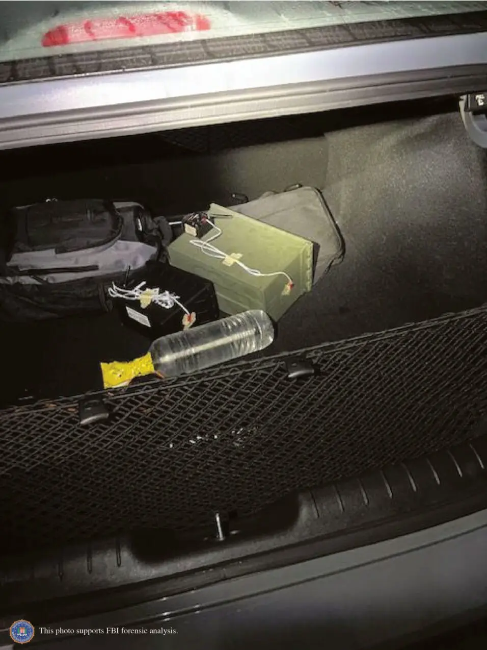 Two improvised explosive devices as initially discovered in Thomas Crooks' car trunk. The receiver for remote detonation was in the 