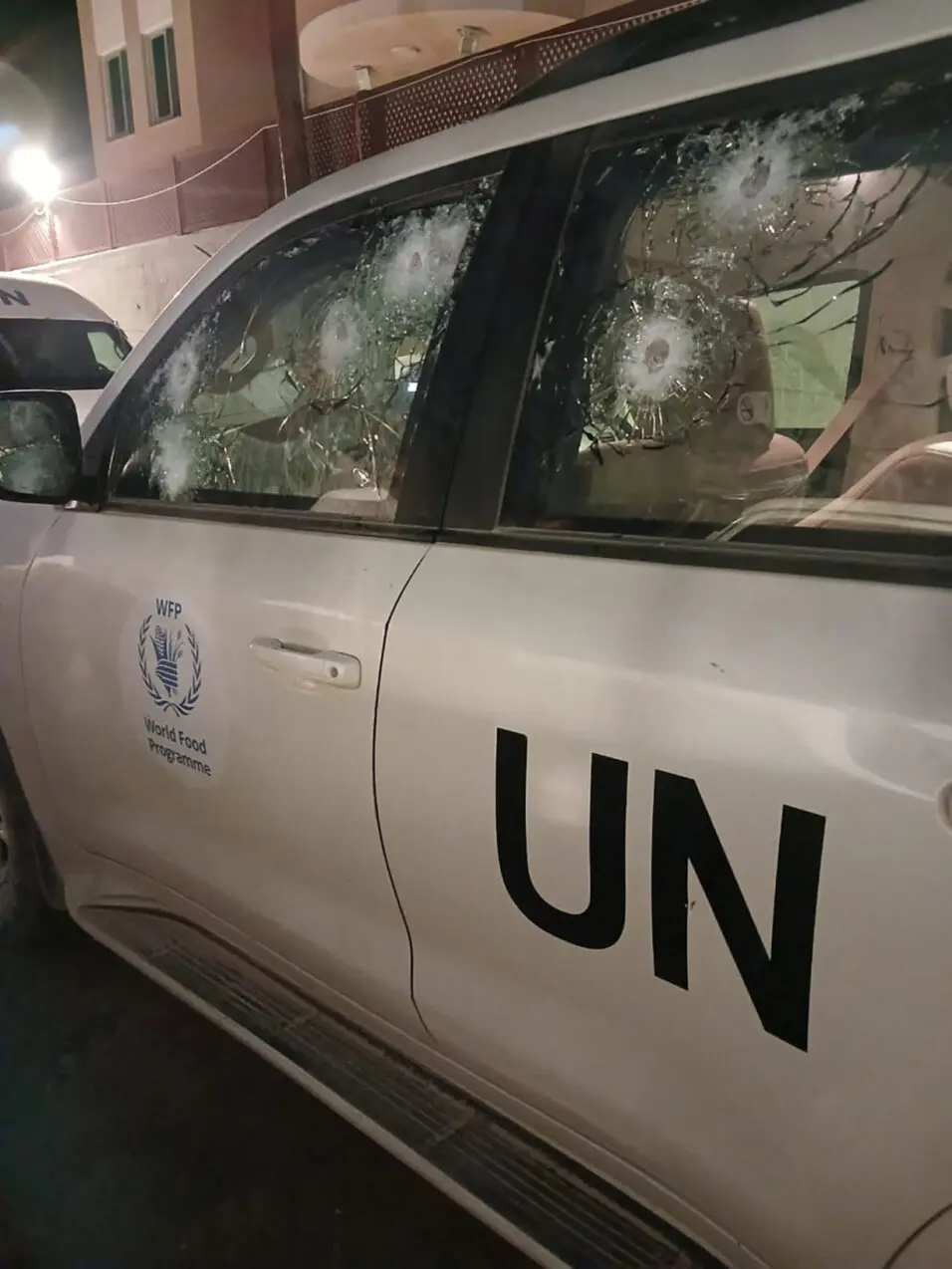 Impacts on a World Food Program's (WFP) bullet-proof windows are seen in Wadi Gaza