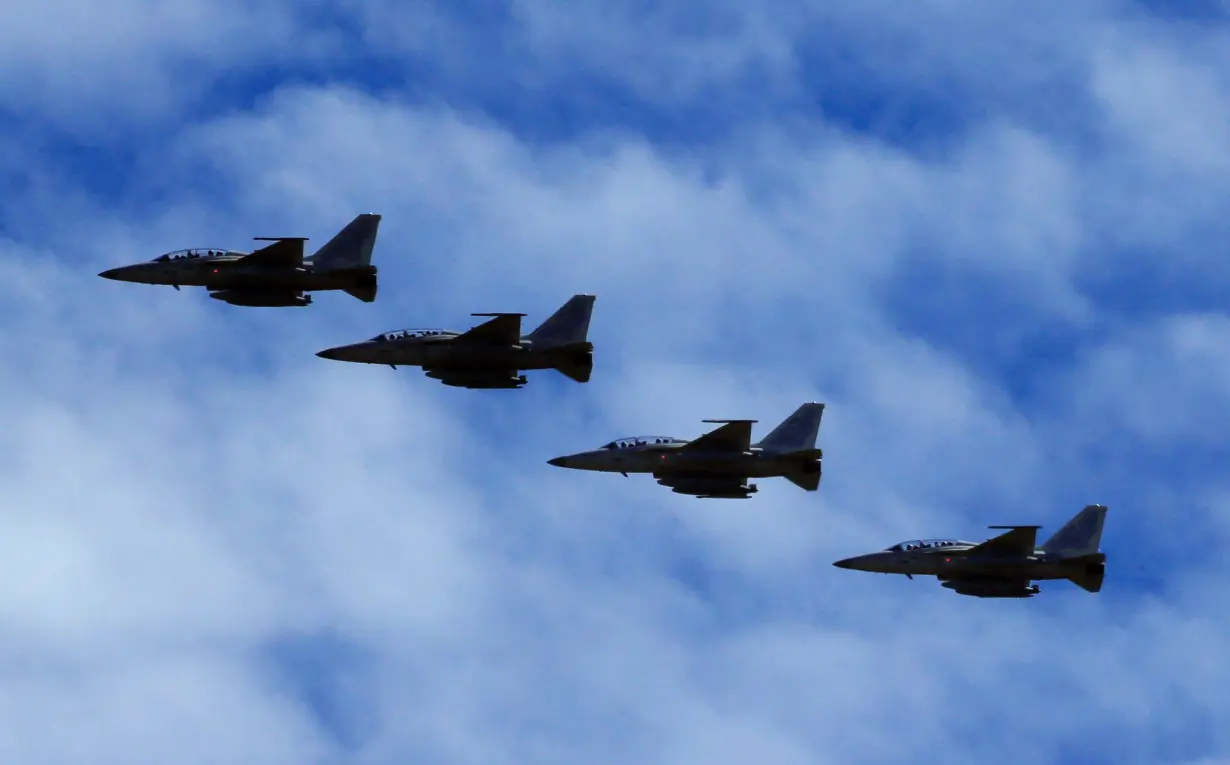 FILE PHOTO: FA-50 fighter jets, newly purchased from South Korea, are escorted by fighter jets in the sky upon arrival in Clark air base, Angeles city, Pampanga province, north of Manila