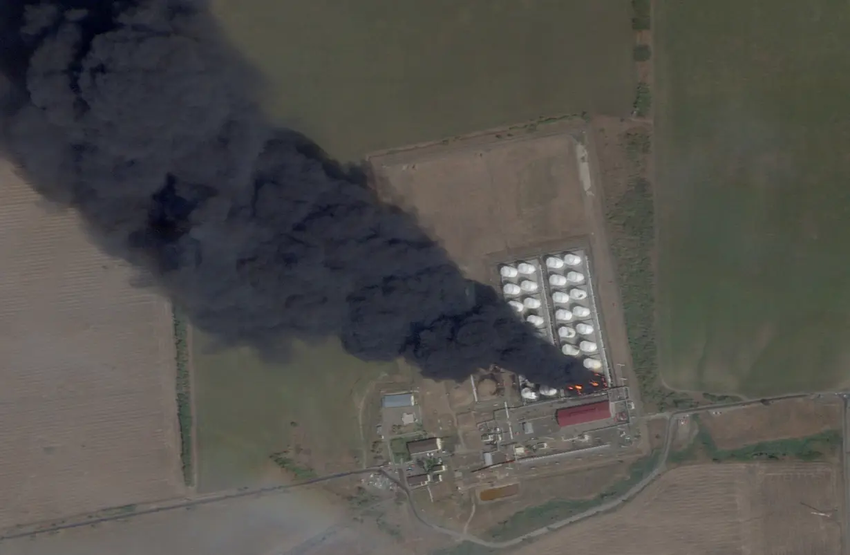 FILE PHOTO: Smoke and fire rise from an oil depot in Rostov Region