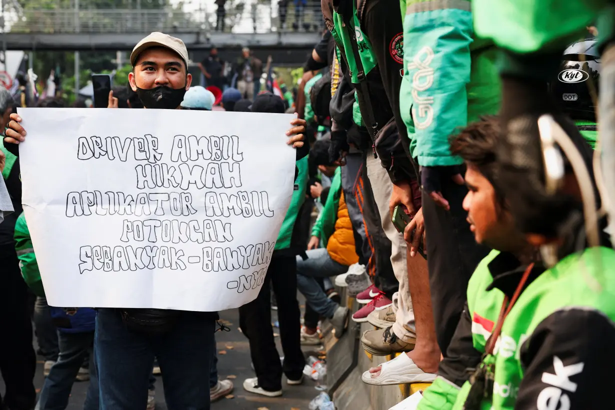 Motorcycle taxi drivers working for online ride-hailing start-ups protest against low tariffs in Jakarta