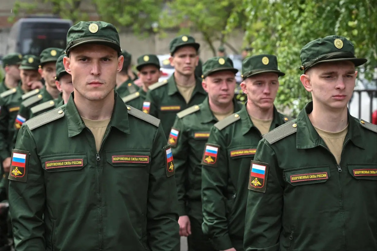 FILE PHOTO: Russian conscripts called up for military service depart from a recruitment centre in Bataysk