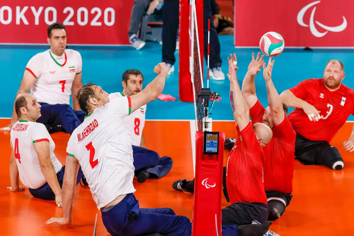 Morteza Mehrzad, the tallest Paralympian, competes for Iran against Russia during the men's sitting volleyball gold match at the Tokyo 2020 Paralympic Games.