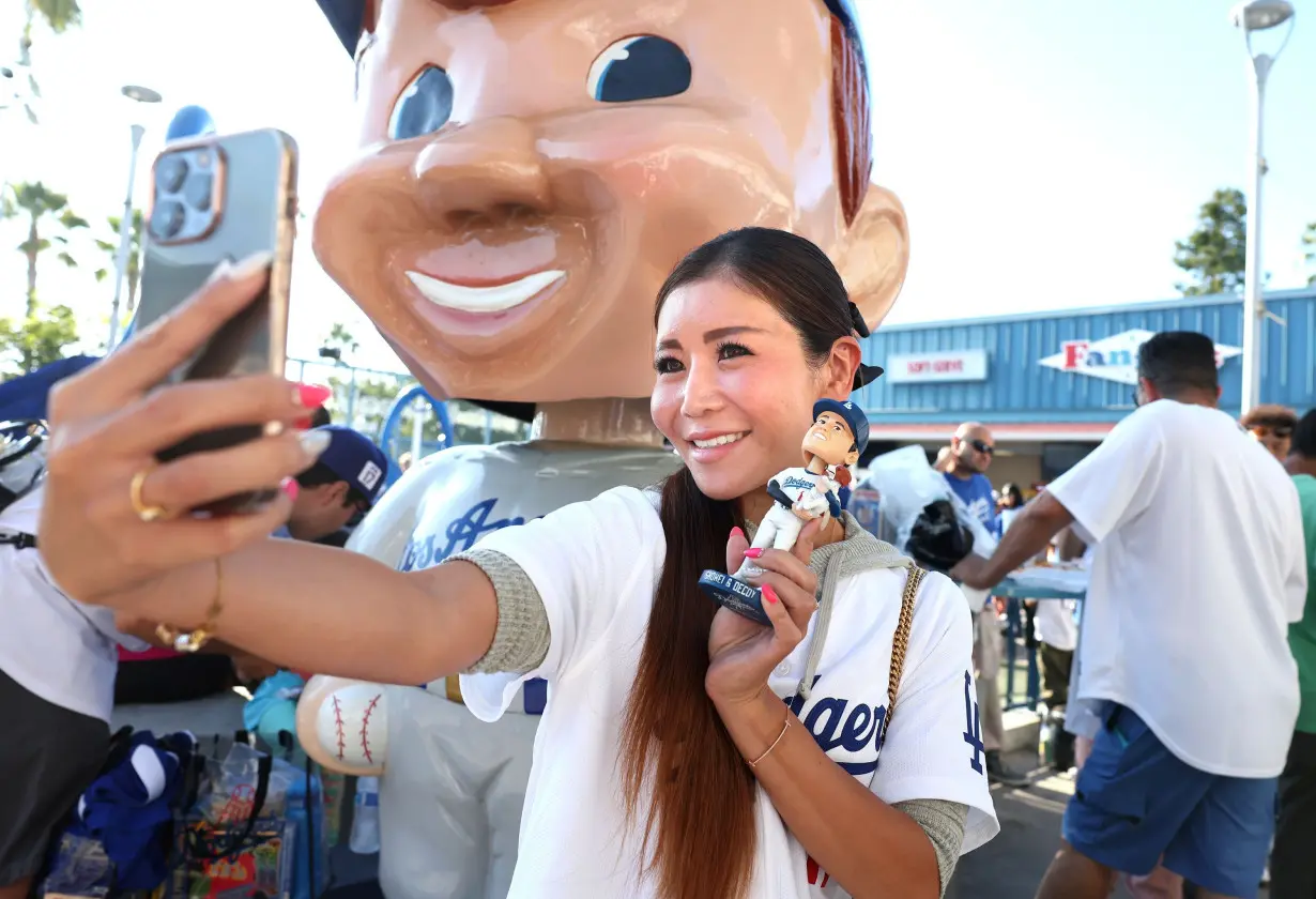 Fans waited for hours before the game to get their hands on a Ohtani and Decoy bobblehead.