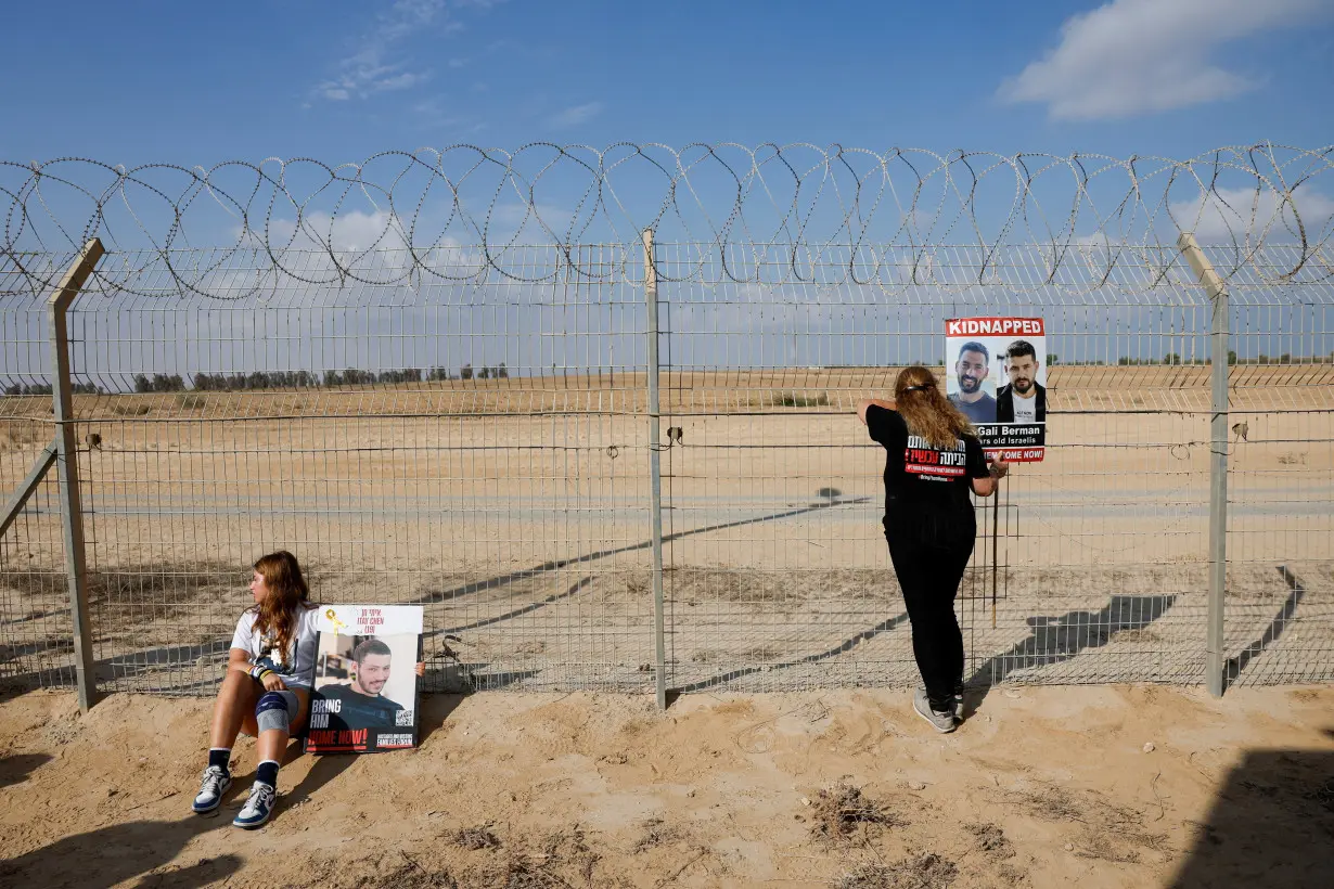 Family members and supporters of hostages kidnapped during October 7 attack use loudspeakers to call their captive loved ones, at Kibbutz Nirim