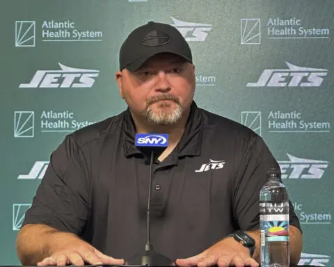 Jets GM Douglas has faith Reddick's holdout will be resolved, but team hasn't changed its stance