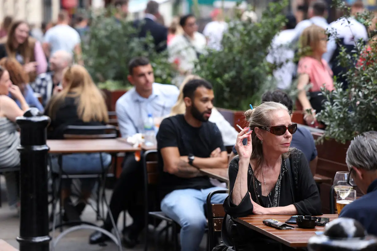 Woman smokes outdoors in London