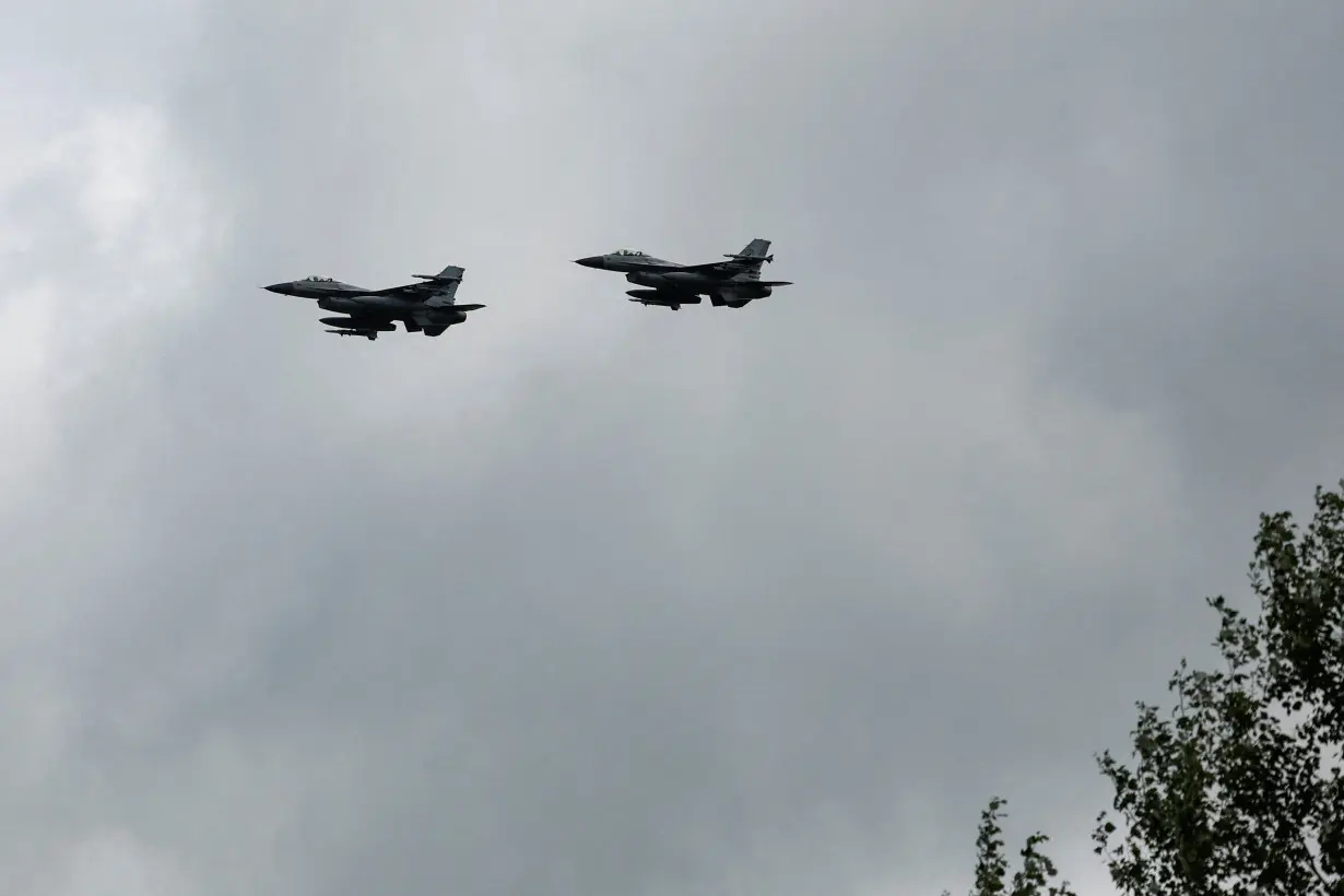 FILE PHOTO: Ukrainian F-16 fighting aircrafts are seen in the air during marking the Day of the Ukrainian Air Forces in an undisclosed location in Ukraine