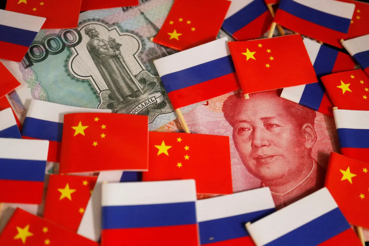 FILE PHOTO: Illustration picture of China's yuan and Russia's rouble banknotes