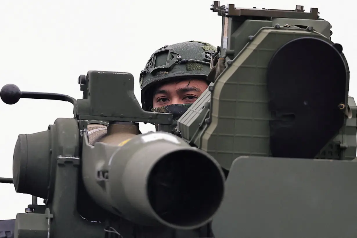 FILE PHOTO: A soldier stands on an M1167 TOW carrier vehicle at the Fangshan training grounds in Pingtung