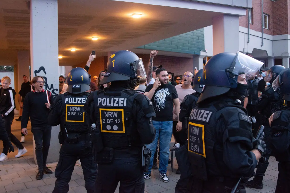 Police block counter-demonstrators as right-wing extremist groups protest against government immigration policy in Solingen, Germany, on August 26.