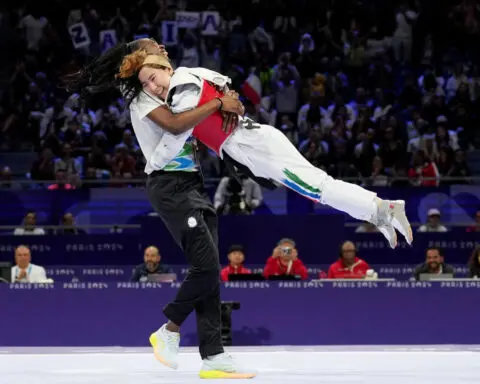 Zakia Khudadadi makes history by winning first-ever Paralympic medal for the refugee team with taekwondo bronze